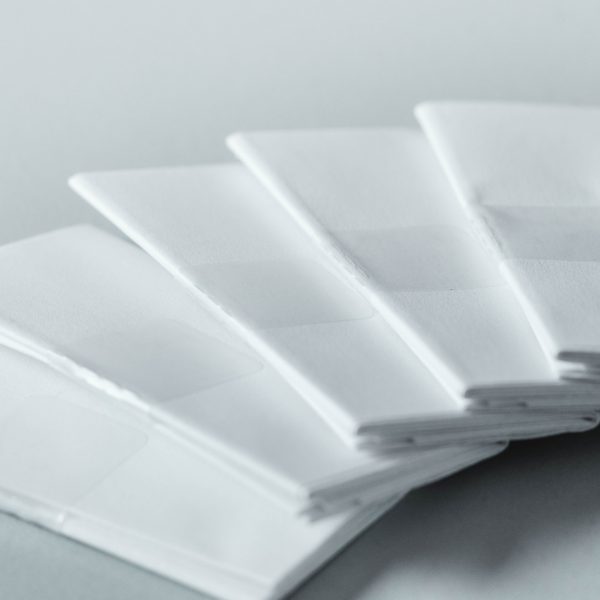 Beipackzettel als Insert mit Klebepunkt drucken